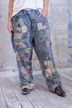 Load image into Gallery viewer, Very baggy jeans with a lot of patches Front view 
