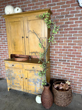 Load image into Gallery viewer, Golden vintage cupboard with brick background