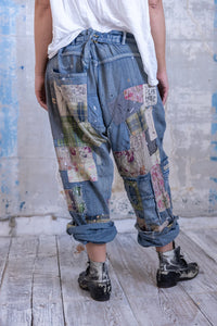 Very baggy jeans with a lot of patches back view 
