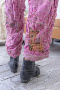 Pink embroidered pants up close of deer on bottom leg
