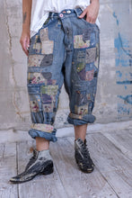 Load image into Gallery viewer, Very baggy jeans with a lot of patches Front view up close
