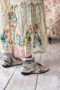 Up close, hem line of floral dress