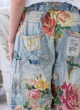 Load image into Gallery viewer, Baggy jeans with rose patches up close bottom view
