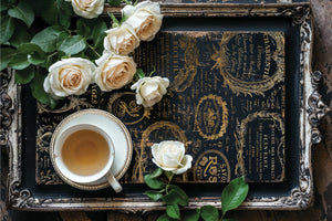 up close view of Golden tray with tea and roses ￼