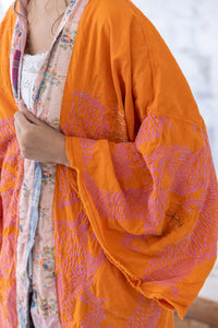 Orange kimono bell sleeve up close