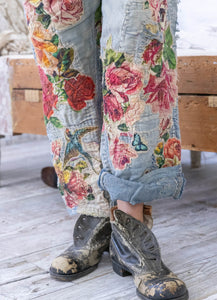 Baggy jeans with rose patches up close view cuffed leg