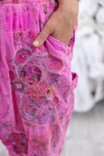 Load image into Gallery viewer, Bear embroidered on pink overalls up close
