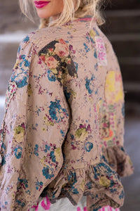 Shoulder and back view of muted floral jacket