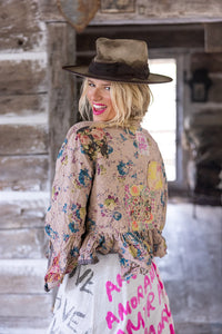 Side / back view of floral jacket and smiling lady. 