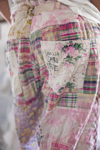 Load image into Gallery viewer, very close view of back patchwork, pants, and Magnolia Pearl logo ￼
