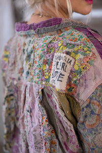 Up close view of patchwork, shoulder, and Magnolia Pearl patch
