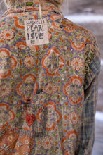 Load image into Gallery viewer, Up close view of back shirt with Magnolia Pearl patch
