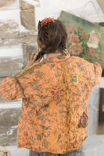 Load image into Gallery viewer, Back view of orange jacket up close
