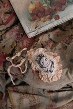 Load image into Gallery viewer, Jabot laying on old fabric 
